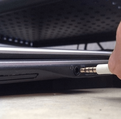 image of laptop where mini jack is plugged into.